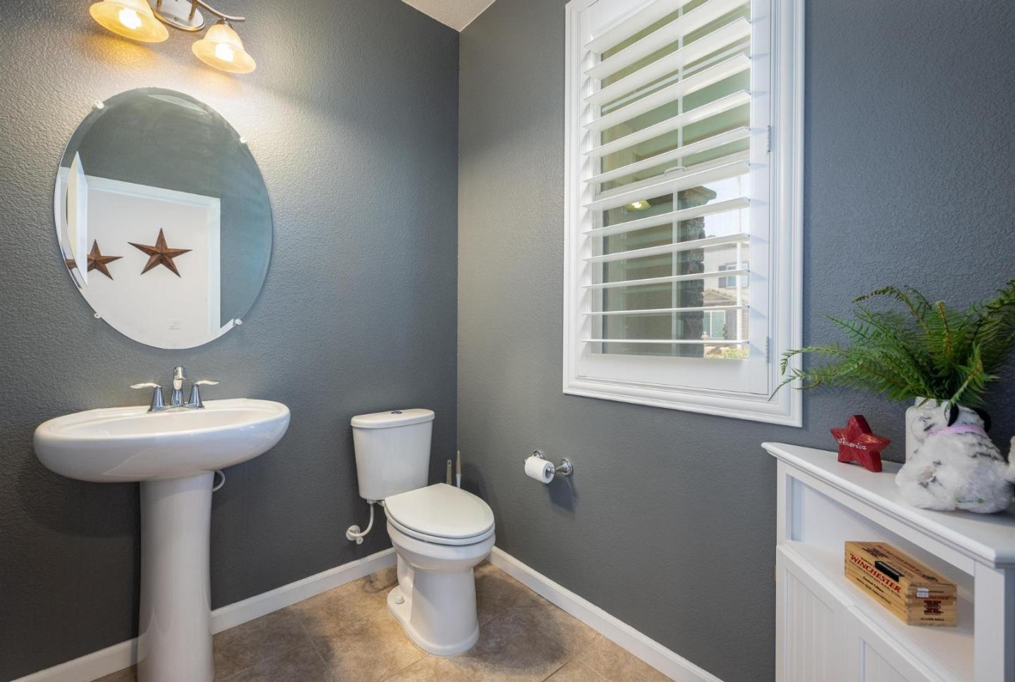 7708 Sumac Place Gilroy, CA 95020 - Photo 5 of 26 a bathroom with a sink toilet and a mirror