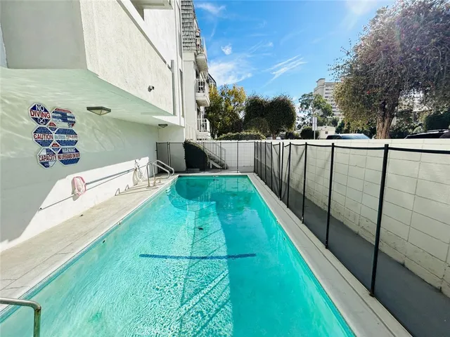a view of swimming pool with a backyard