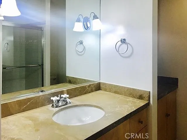 a bathroom with a sink and a mirror