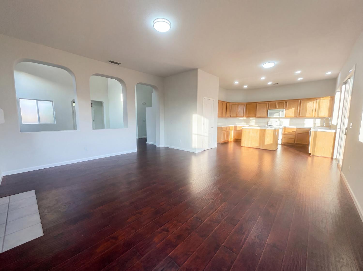 8137 Wyndwillow Way Elk Grove, CA 95758 - Photo 14 of 41 a view of an empty room with wooden floor