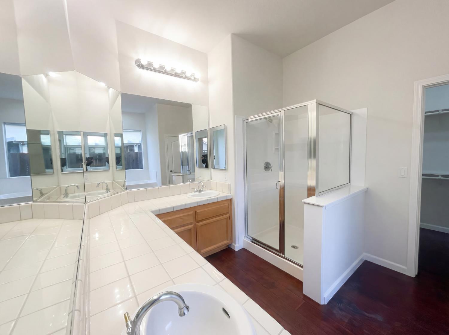 8137 Wyndwillow Way Elk Grove, CA 95758 - Photo 28 of 41 a spacious bathroom with a tub and shower