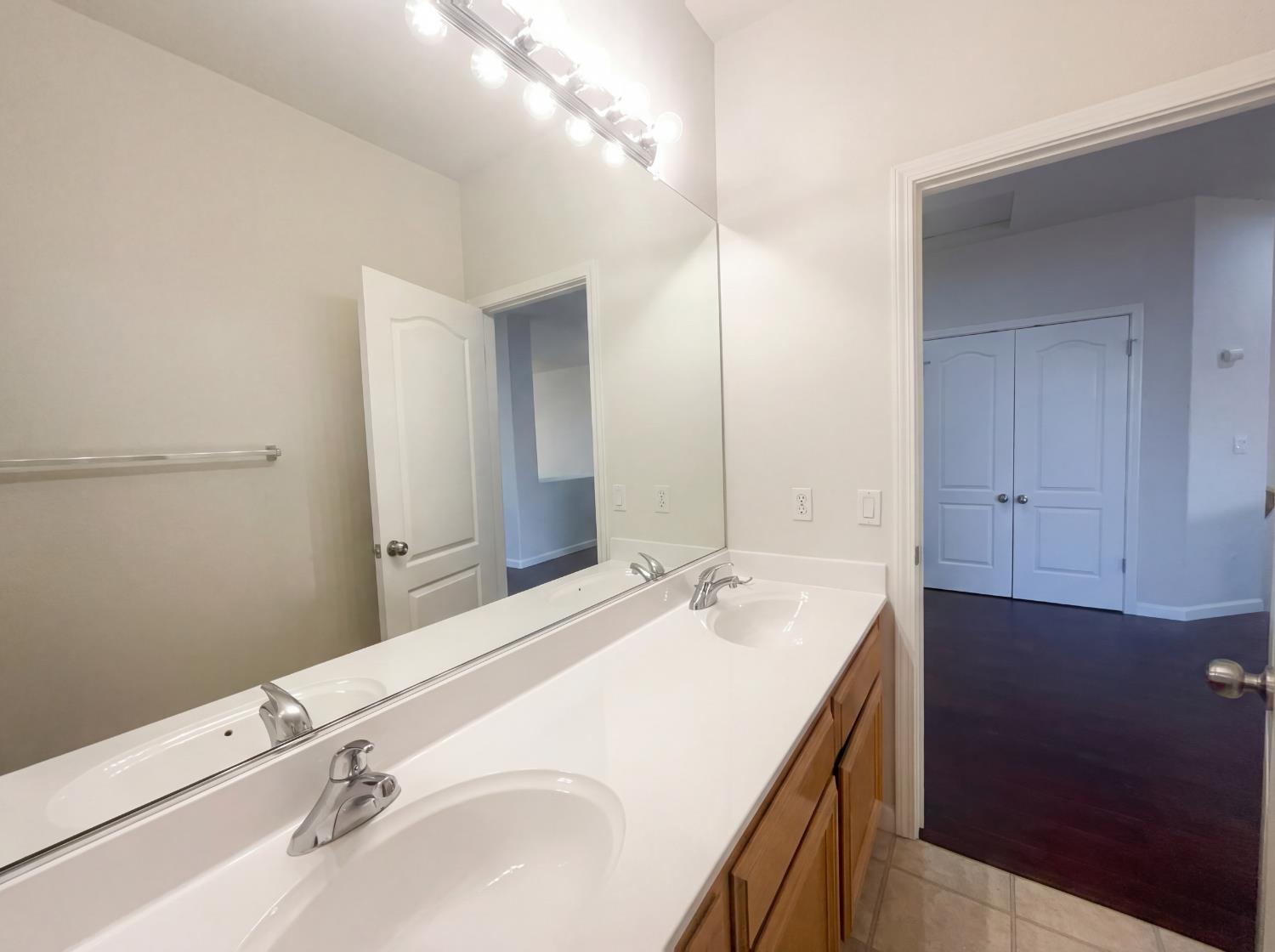 8137 Wyndwillow Way Elk Grove, CA 95758 - Photo 36 of 41 a bathroom with a sink and a mirror