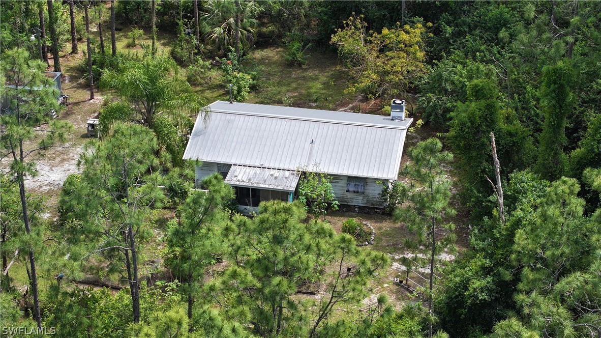 720 E Road LaBelle, FL 33935 - Photo 12 of 40 an aerial view of a house with yard and outdoor seating