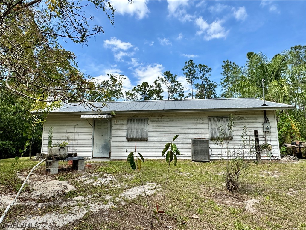 720 E Road LaBelle, FL 33935 - Photo 18 of 40 front view of a house with a yard