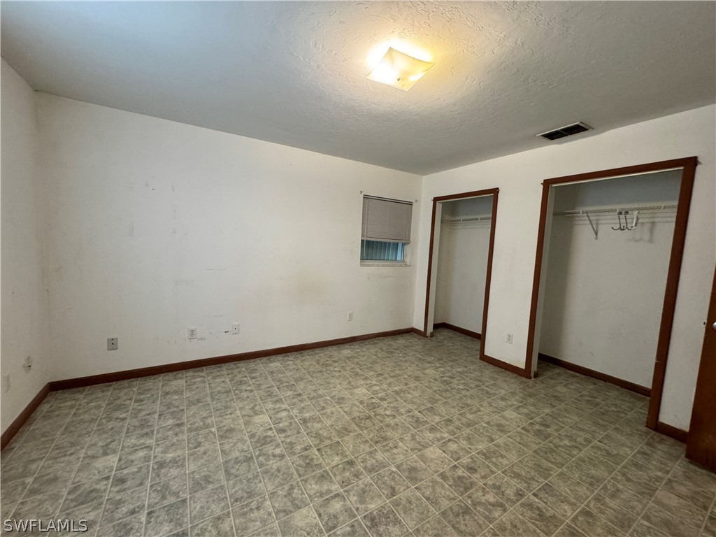 720 E Road LaBelle, FL 33935 - Photo 20 of 40 an empty room with closet