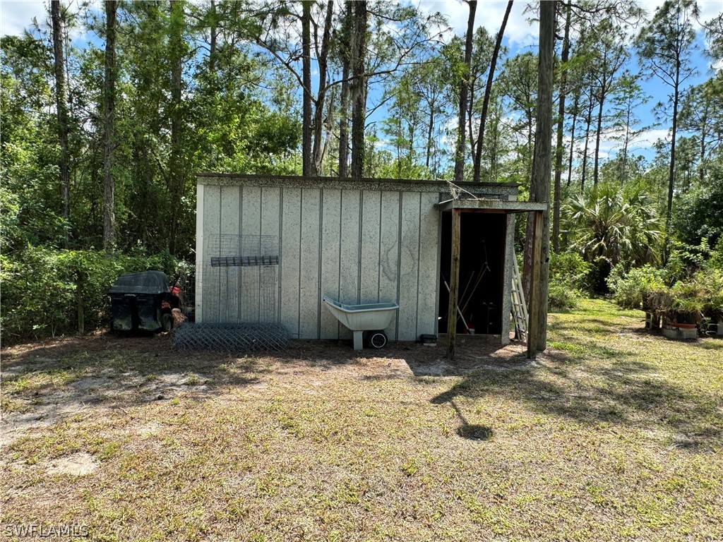 720 E Road LaBelle, FL 33935 - Photo 23 of 40 a view of a barn in the middle of a yard