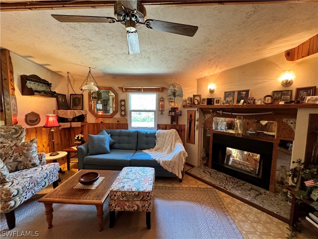 720 E Road LaBelle, FL 33935 - Photo 34 of 40 a living room with furniture and a fireplace