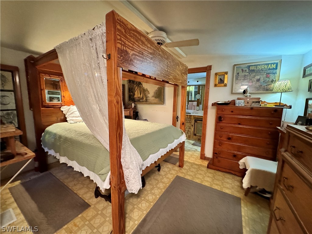 720 E Road LaBelle, FL 33935 - Photo 38 of 40 a bedroom with a bed and furniture