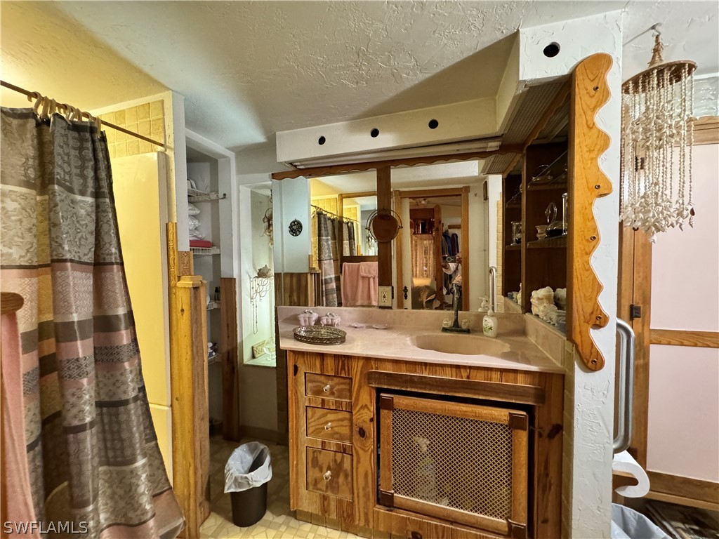 720 E Road LaBelle, FL 33935 - Photo 39 of 40 a kitchen with a sink and a refrigerator