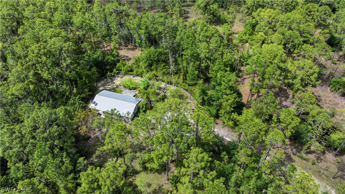 720 E Road LaBelle, FL 33935 - Photo 5 of 40 an aerial view of a house with a yard and outdoor seating