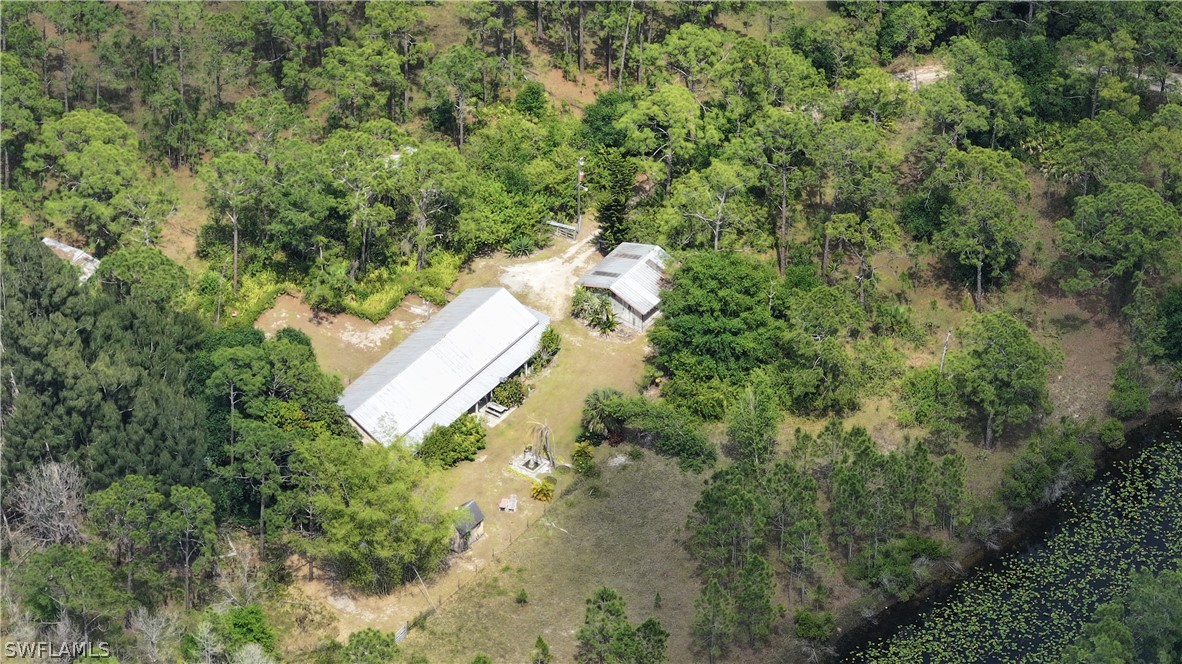 720 E Road LaBelle, FL 33935 - Photo 7 of 40 an aerial view of a house with a yard and trees