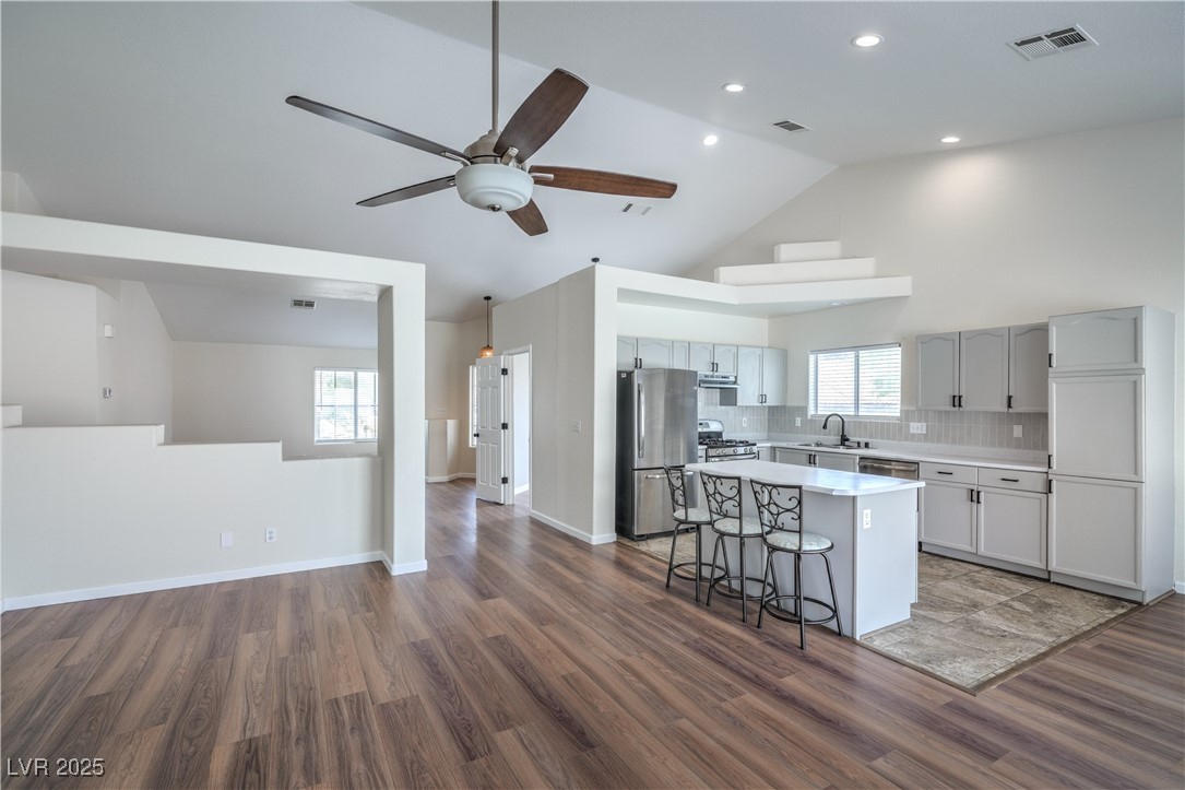 818 Coastal Beach Road Henderson, NV 89002 - Photo 13 of 39 Kitchen featuring light countertops, backsplash, s