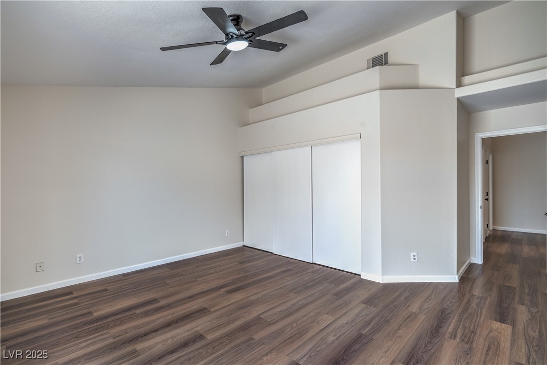 818 Coastal Beach Road Henderson, NV 89002 - Photo 20 of 39 Primary Bedroom featuring dark wood-style flooring