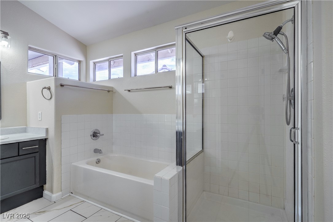 818 Coastal Beach Road Henderson, NV 89002 - Photo 24 of 39 Primary bath featuring a shower stall, a bath, van