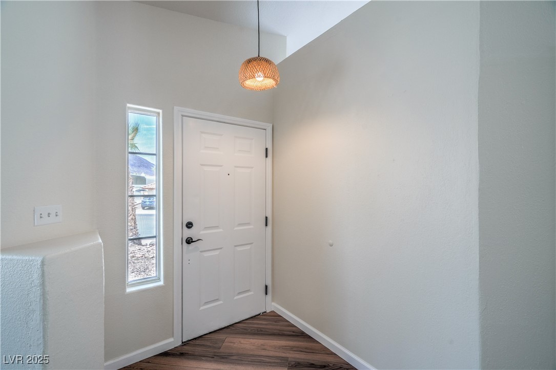 818 Coastal Beach Road Henderson, NV 89002 - Photo 5 of 39 Entryway with dark wood-style floors and baseboard