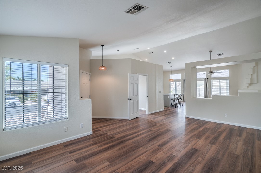 818 Coastal Beach Road Henderson, NV 89002 - Photo 8 of 39 Unfurnished living room featuring dark wood finish