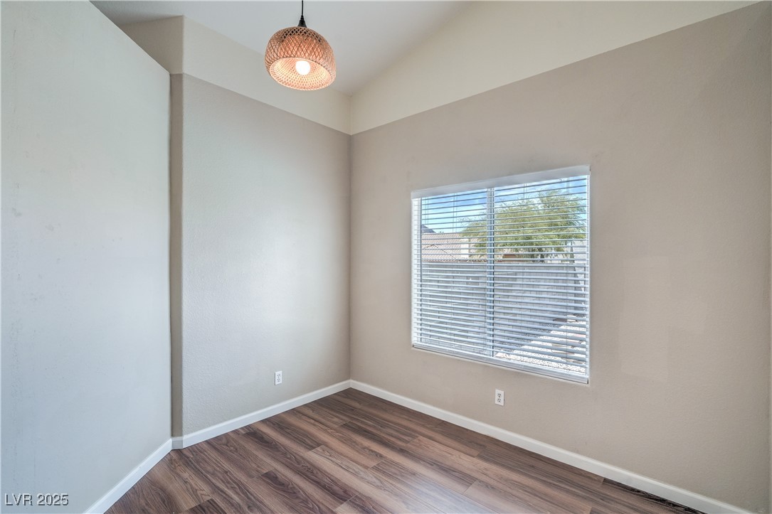 818 Coastal Beach Road Henderson, NV 89002 - Photo 9 of 39 Den/Office with dark laminate floors and vaulted c