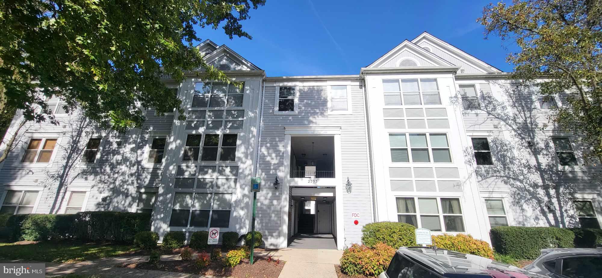 2703 Leaf Drop Court, Unit 817 Silver Spring, MD 20906 - Photo 1 of 16 a front view of a building with street view