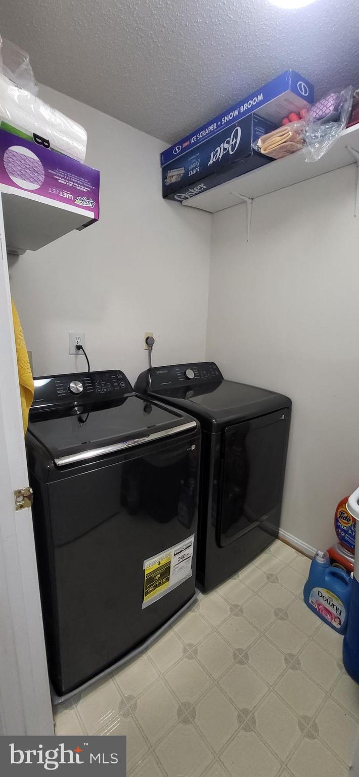 2703 Leaf Drop Court, Unit 817 Silver Spring, MD 20906 - Photo 15 of 16 a utility room with dryer and washer
