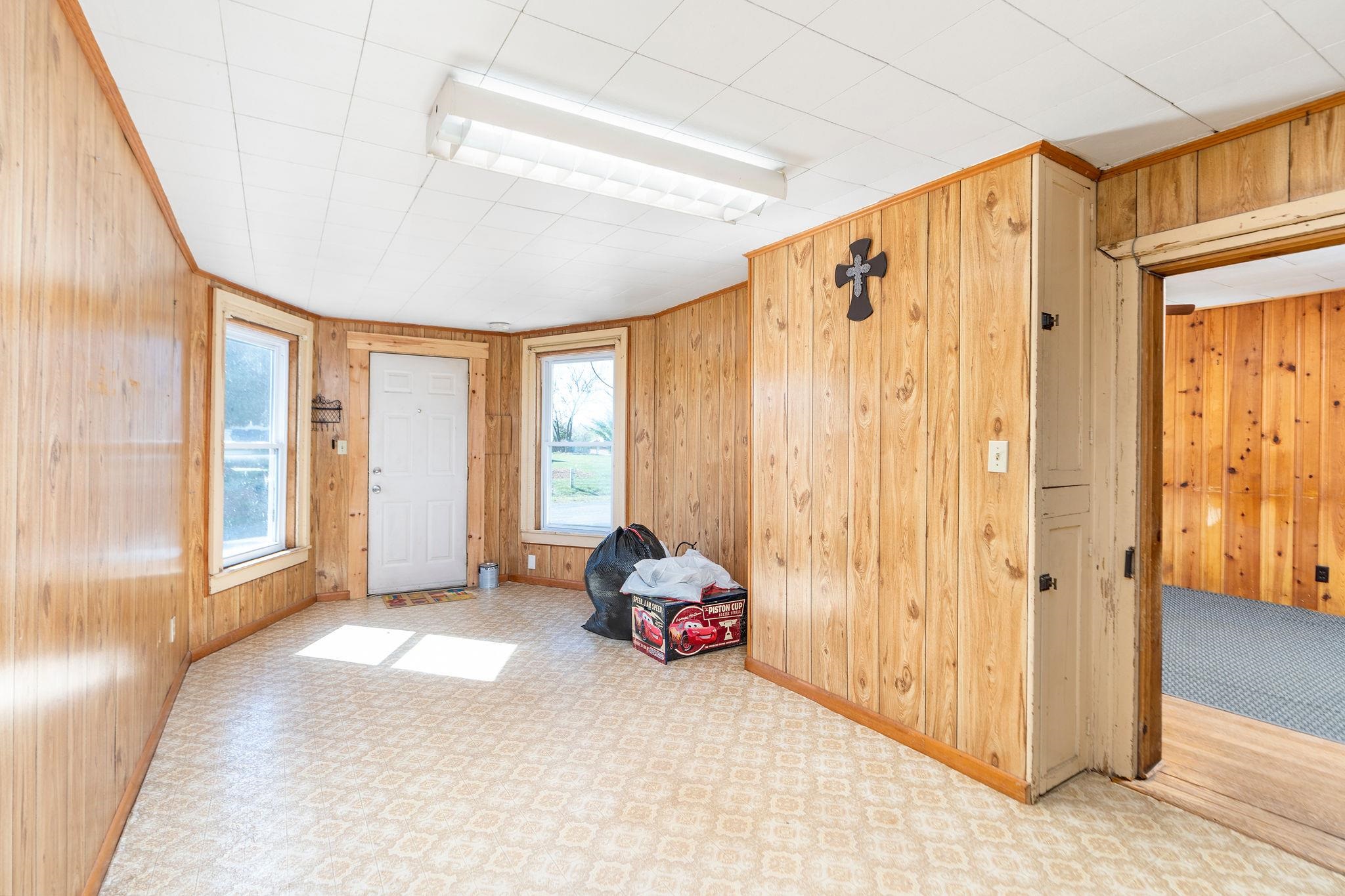 2061 Cecil Wampler Road Mount Crawford, VA 22841 - Photo 16 of 70 a living room with a large window and a chandelier