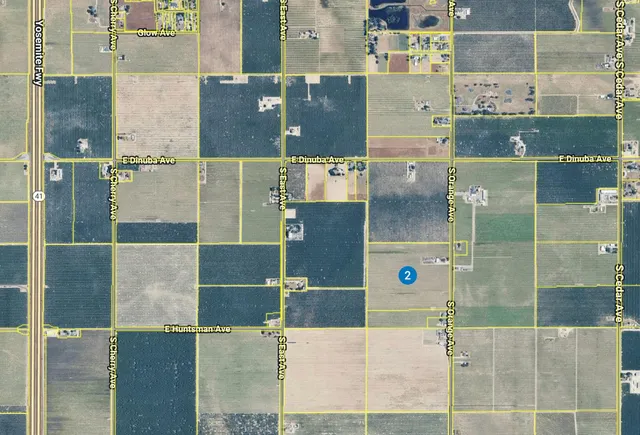 a view of a back yard from a balcony