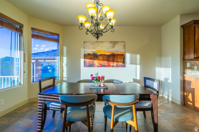 2212 Chippenham Court St. George, UT 84770 - Photo 14 of 75 Dining area with stone tile floors and a chandelier