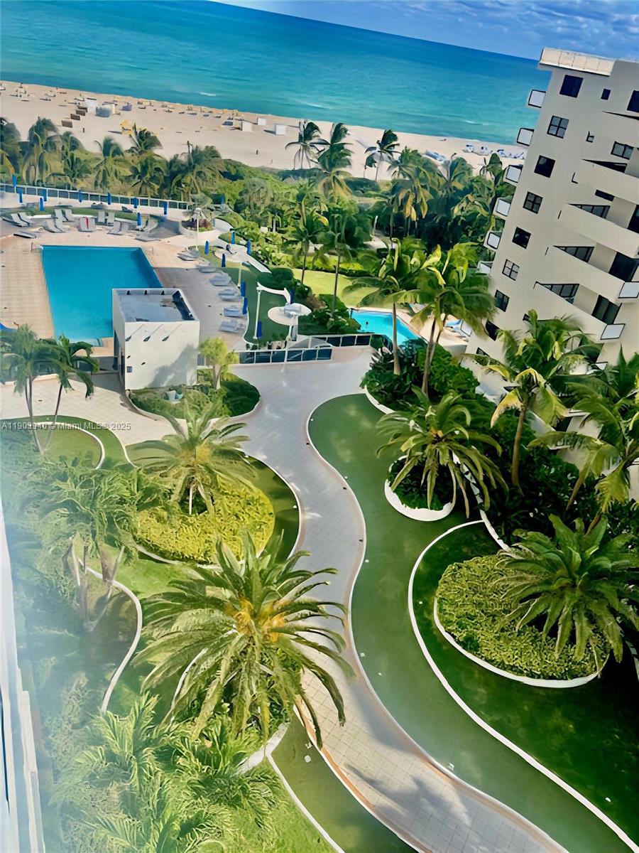 100 Lincoln Road, Unit 1030 Miami Beach, FL 33139 - Photo 13 of 35 a view of a swimming pool with a garden