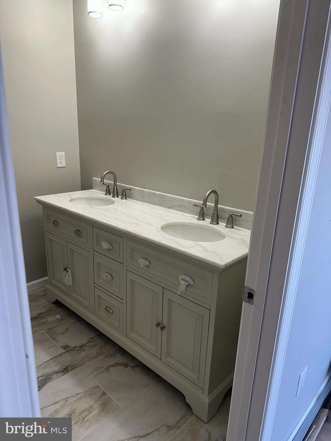 6201 Eastern Avenue Baltimore, MD 21224 - Photo 6 of 7 a bathroom with a sink and a mirror