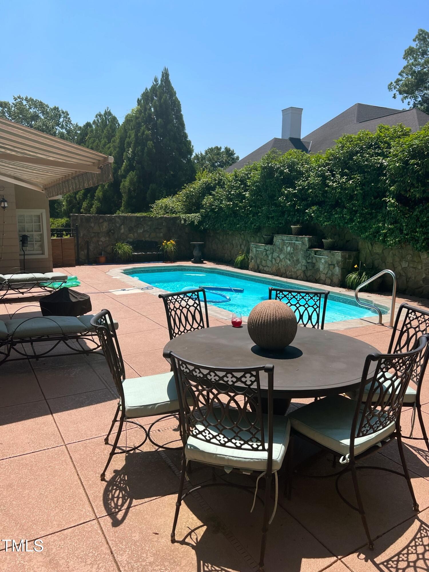 1524 Jarvis Street Raleigh, NC 27608 - Photo 45 of 49 Outdoor Oasis with Saltwater, Heated Pool, Stone Fireplace, Built-In Grill and Beverage Fridge