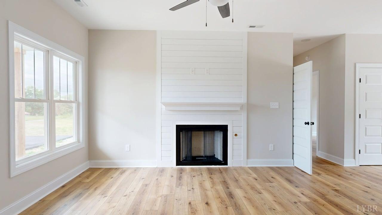 3729 Kentuck Road Ringgold, VA 24586 - Photo 11 of 42 a view of an empty room with window and fire place