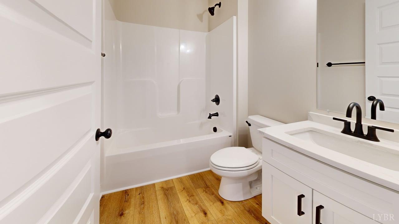 3729 Kentuck Road Ringgold, VA 24586 - Photo 18 of 42 a bathroom with a sink toilet and shower