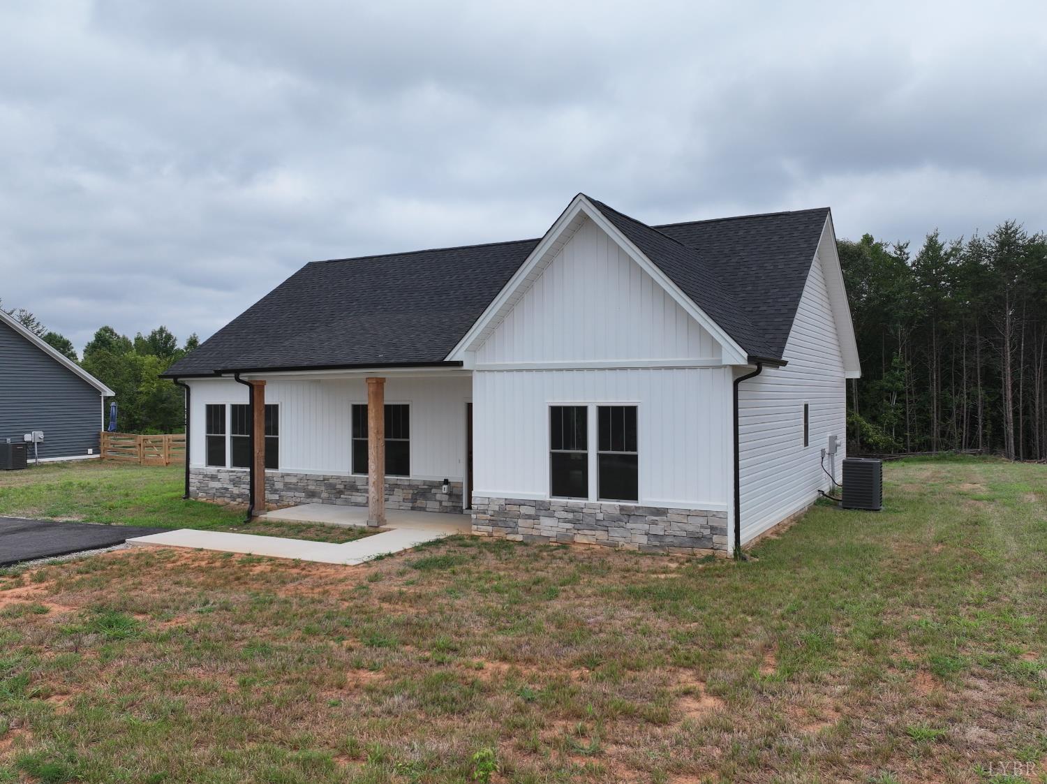 3729 Kentuck Road Ringgold, VA 24586 - Photo 2 of 42 a view of a house with yard and a garden