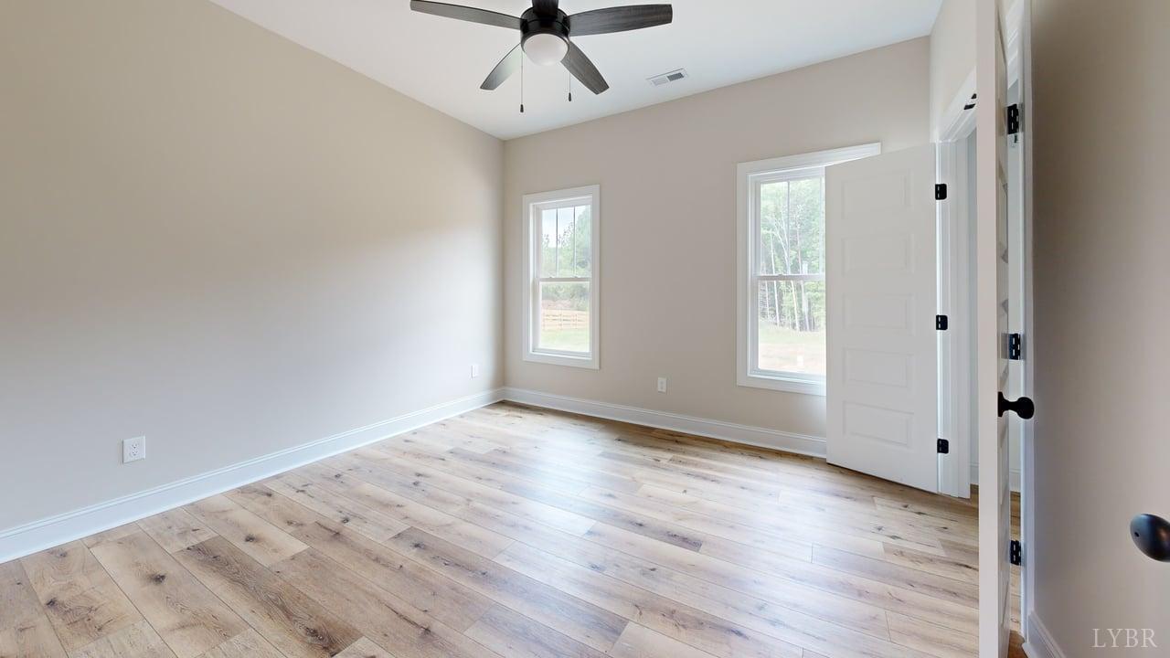 3729 Kentuck Road Ringgold, VA 24586 - Photo 22 of 42 wooden floor in an empty room with a window