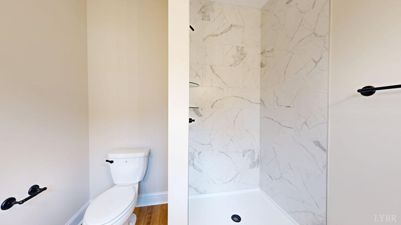 3729 Kentuck Road Ringgold, VA 24586 - Photo 24 of 42 a bathroom with a bathtub and a toilet