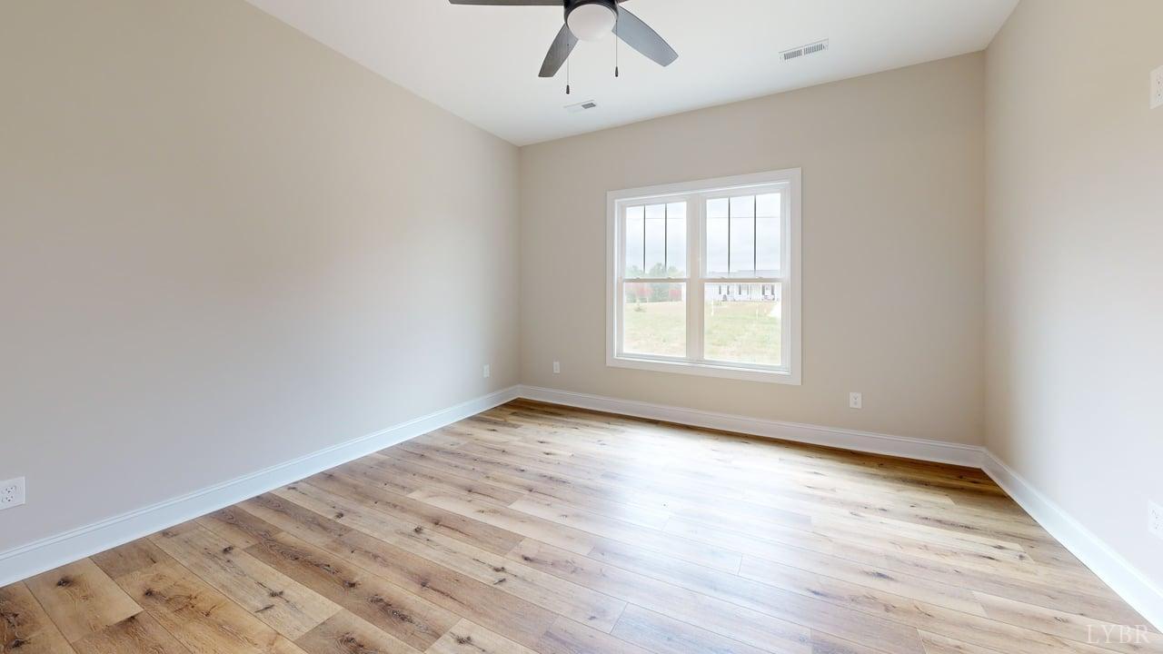 3729 Kentuck Road Ringgold, VA 24586 - Photo 26 of 42 wooden floor in an empty room with a window
