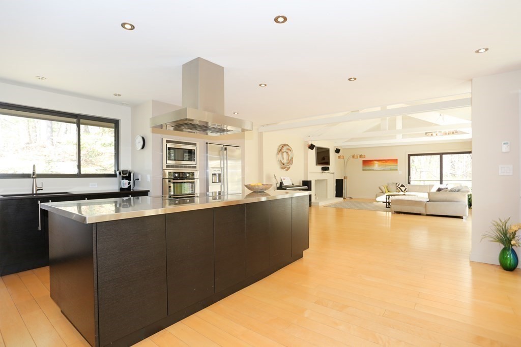 10 Country Corners Road Wayland, MA 01778 - Photo 11 of 32 a view of a living room and kitchen with a sink