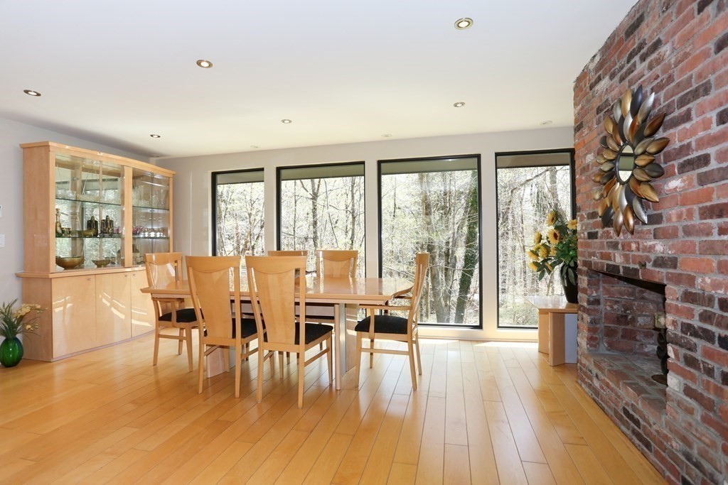 10 Country Corners Road Wayland, MA 01778 - Photo 12 of 32 a living room with fireplace furniture and a large window
