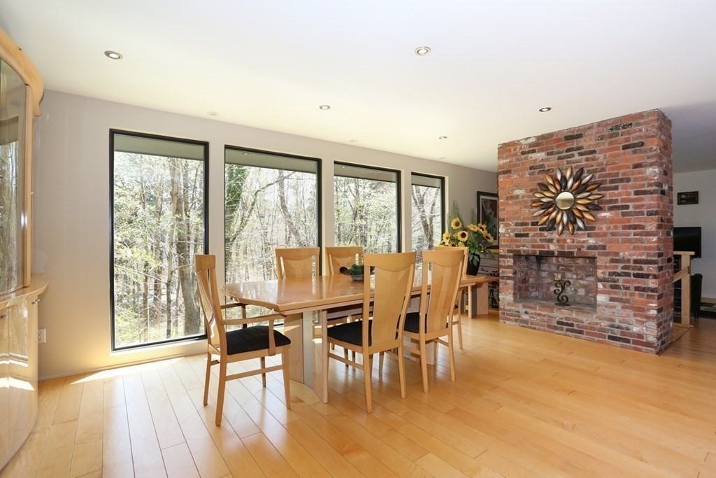 10 Country Corners Road Wayland, MA 01778 - Photo 13 of 32 a dining room with furniture water view and large windows