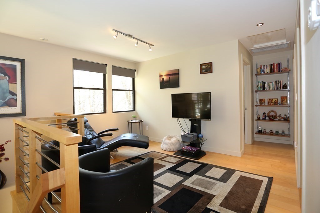 10 Country Corners Road Wayland, MA 01778 - Photo 14 of 32 a work room with furniture a flat screen tv and a window