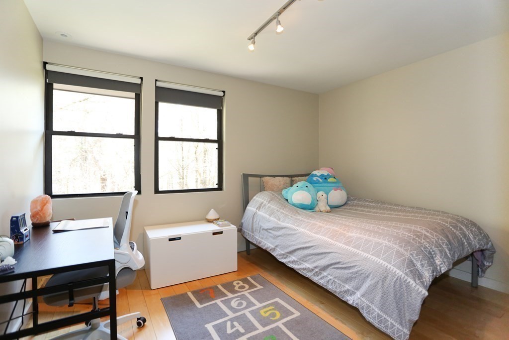 10 Country Corners Road Wayland, MA 01778 - Photo 18 of 32 a bedroom with a bed and a window