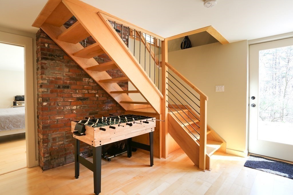 10 Country Corners Road Wayland, MA 01778 - Photo 21 of 32 a view of a balcony with furniture and a stove