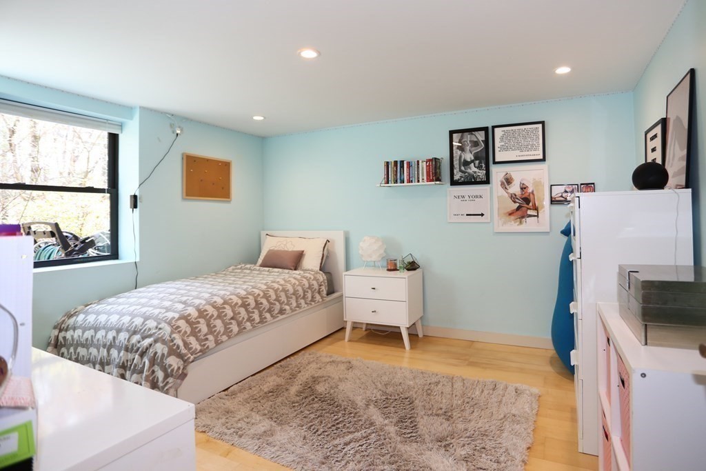 10 Country Corners Road Wayland, MA 01778 - Photo 23 of 32 a bedroom with a bed and a flat screen tv