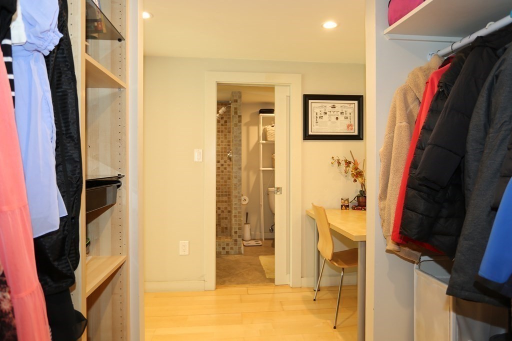 10 Country Corners Road Wayland, MA 01778 - Photo 28 of 32 a view of walk in closet with clothes and shoes