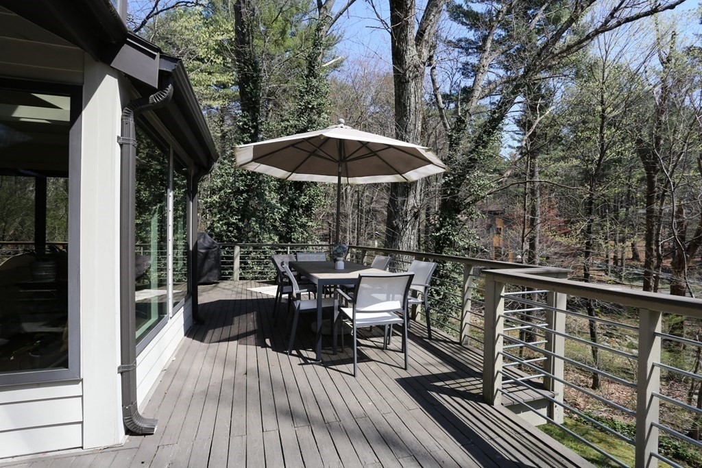 10 Country Corners Road Wayland, MA 01778 - Photo 29 of 32 a view of balcony with outdoor seating and wooden floor