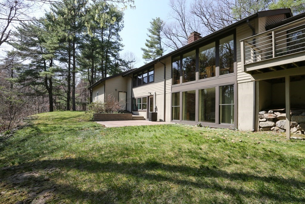 10 Country Corners Road Wayland, MA 01778 - Photo 31 of 32 a front view of a house with yard and green space