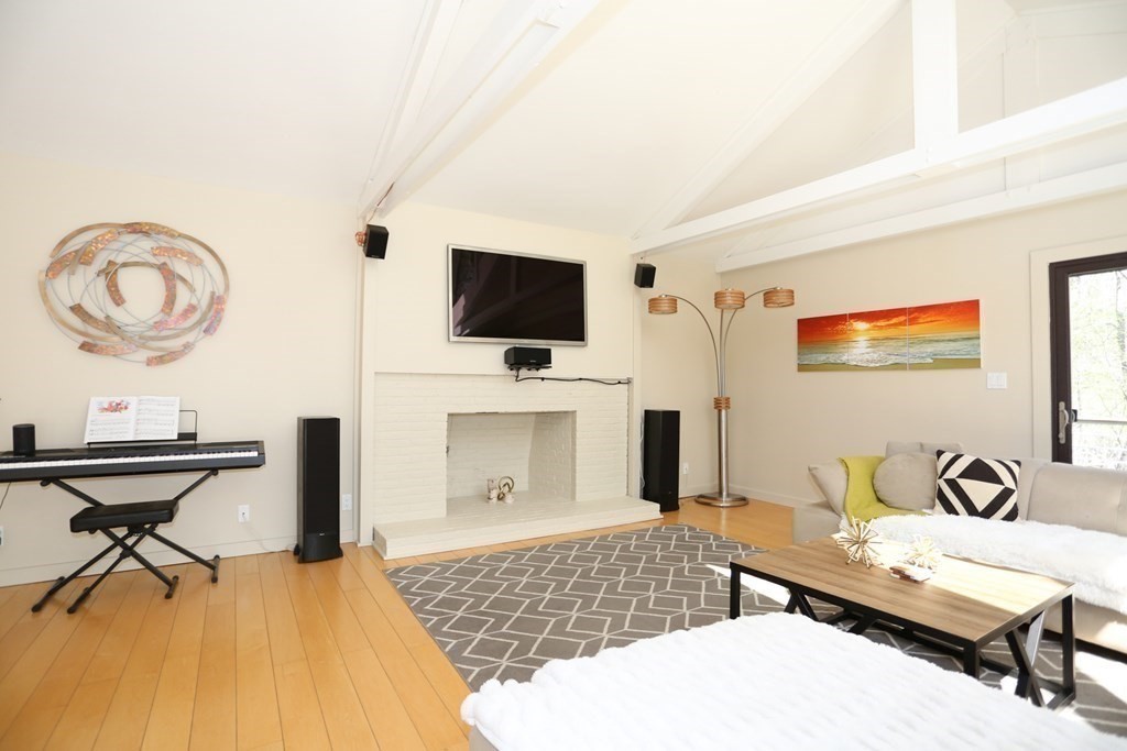 10 Country Corners Road Wayland, MA 01778 - Photo 5 of 32 a living room with furniture and a flat screen tv