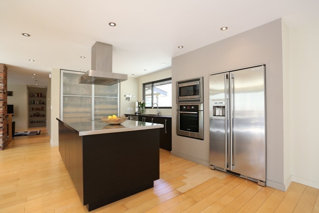 10 Country Corners Road Wayland, MA 01778 - Photo 8 of 32 a kitchen with kitchen island a counter top space and stainless steel appliances