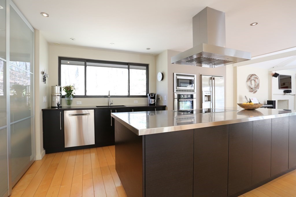 10 Country Corners Road Wayland, MA 01778 - Photo 10 of 32 a kitchen with stainless steel appliances granite countertop a sink a stove and refrigerator