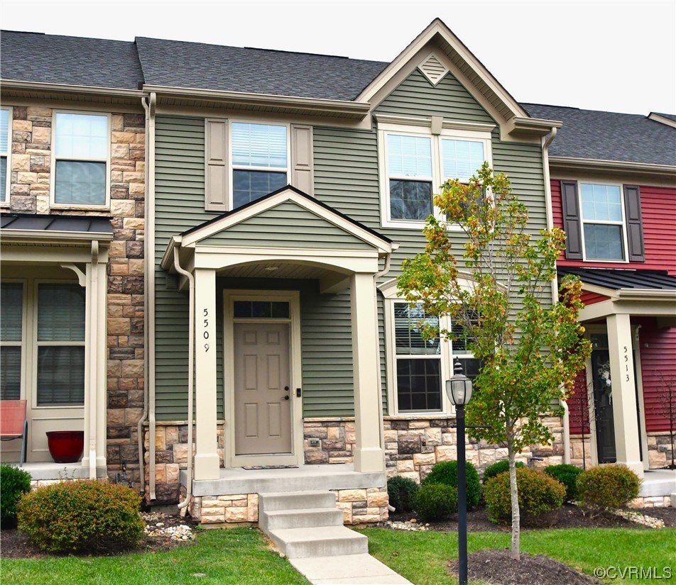 5509 Riverside Heights Way Richmond, VA 23225 - Photo 1 of 28 a front view of a house with a yard and potted plants