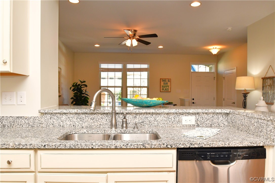 5509 Riverside Heights Way Richmond, VA 23225 - Photo 12 of 28 a bathroom with a granite countertop sink a large mirror and vanity